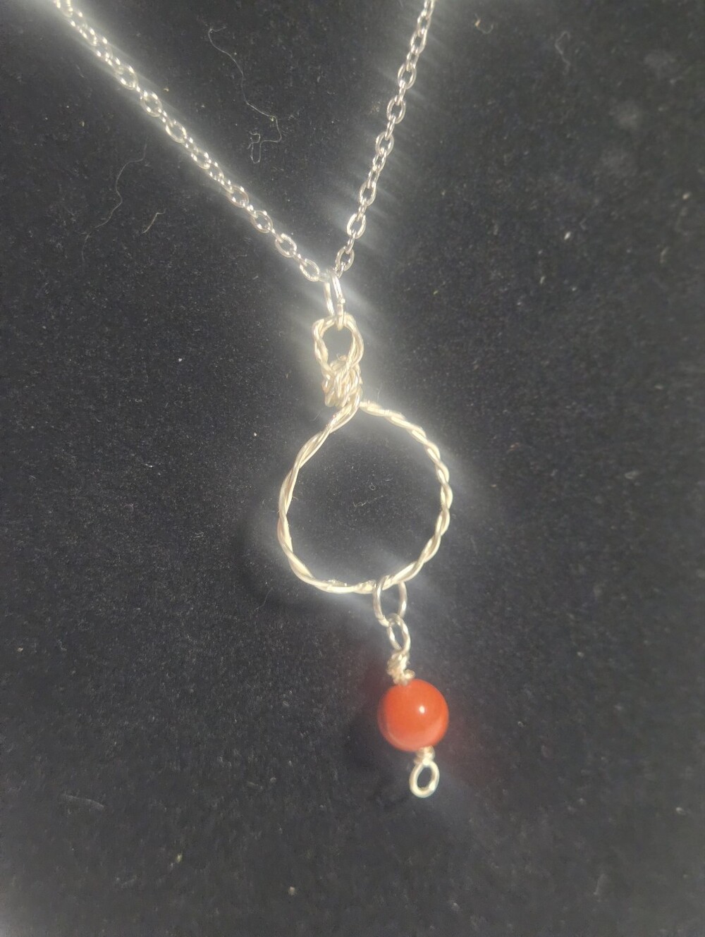 Handcrafted Silver Circle Necklace with Red Bead Pendant